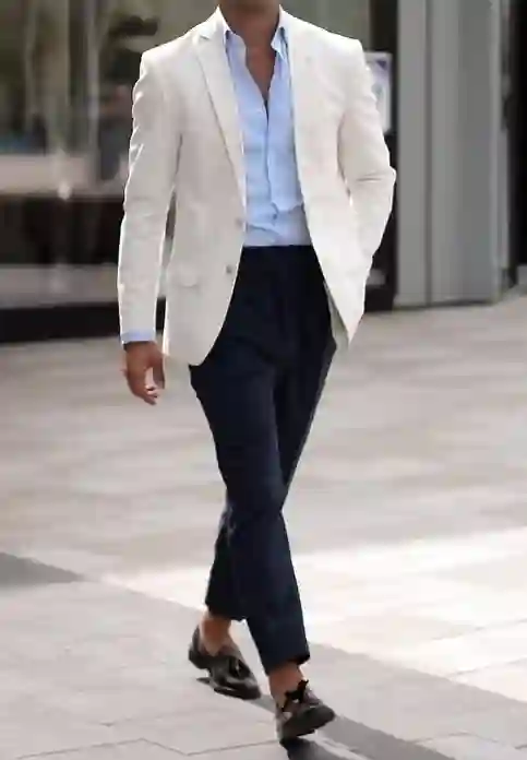 White Blazer with a Light Blue Shirt
